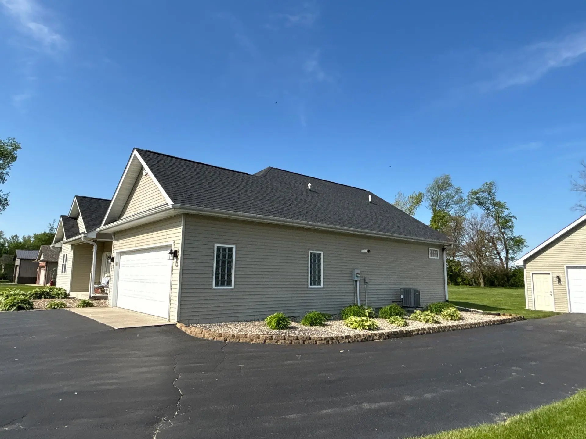 New shingle roof replacement completed on a residential home in Northwest Indiana by Quad County Roofing.